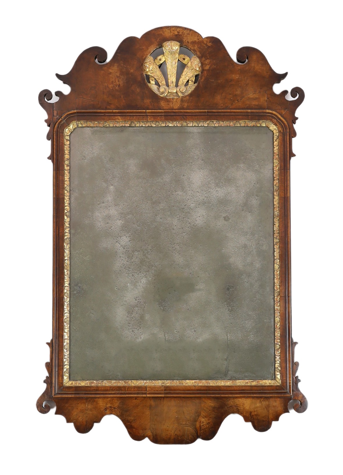 A George II walnut and parcel gilt fret frame wall mirror